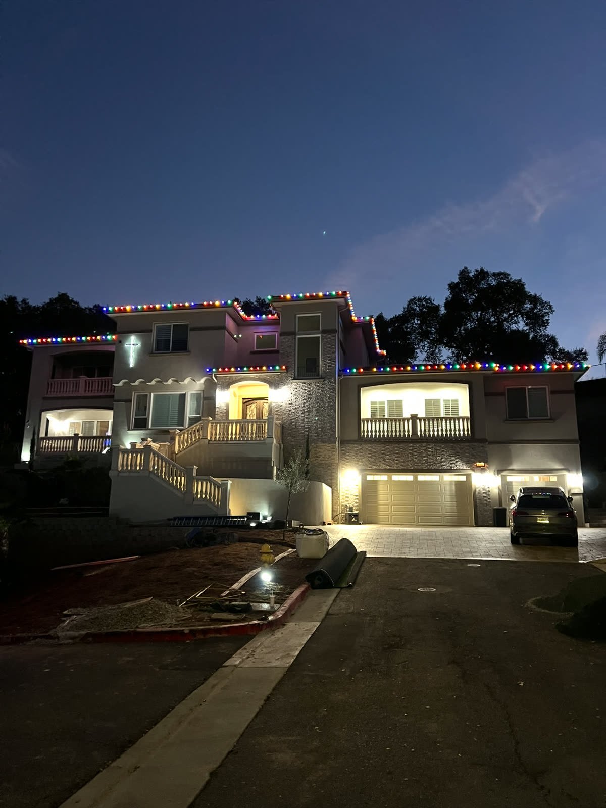 Multicolor roofline lighting on a large home