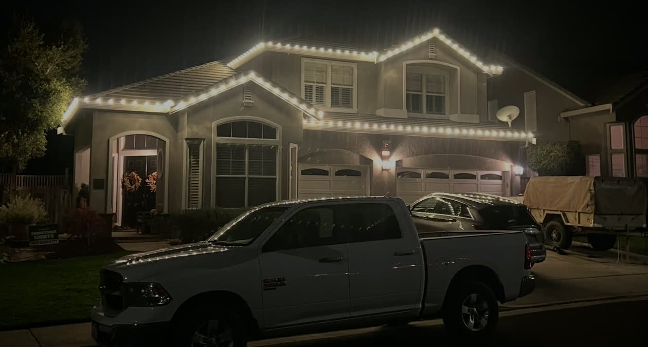 The South County truck in front of a finished roofline installation